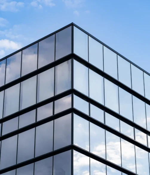 modern-glass-building-architecture-with-blue-sky-clouds_result